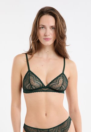 Dunkelgrüner Spitzen-Bralette mit dreieckiger Form, dünnen Trägern, gewellten Kanten und transparentem Überzug mit wellenförmigen Musterdetails.