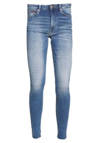 Jeans ajustados en tonos degradados de denim azul, con una cintura de altura media, diseño de cinco bolsillos y un sutil desvanecimiento en los muslos.