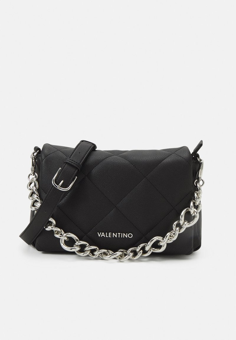 Black quilted leather handbag with a silver chain strap and buckle detail. Features a logo on the front and a textured surface.