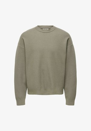 Maglione lavorato a maglia verde oliva con scollatura a girocollo, spalle cadenti e polsini e orlo a costine. Tessuto strutturato con una vestibilità rilassata.