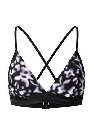 Biustonosz typu bralette w czarno-biały wzór, z cienkimi krzyżowanymi ramiączkami oraz czarną elastyczną taśmą z zapięciem z tyłu.