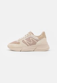 Beige sneakers with mesh and suede materials, featuring a wavy design and light tan accents, round toe, and flat rubber sole.