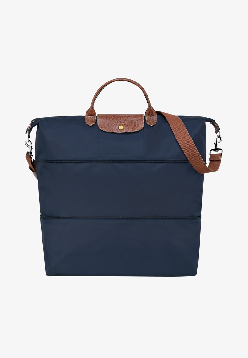 Navy blue tote bag with leather accents, top handles, and a detachable shoulder strap. Features zippered compartments for organization.
