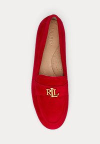 Red suede loafer with gold "RL" logo on strap and tan perforated leather insole, flat sole, and rounded toe.