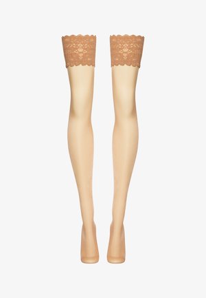 Calze lunghe beige con una dettagliata parte superiore in pizzo. Texture liscia, finitura leggermente lucida e orlo scallop lungo il pizzo.