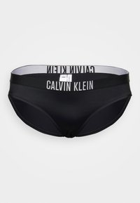 Funda de biquíni preta com um tecido liso e elástico. Apresenta uma cintura larga com "CALVIN KLEIN" impresso em branco. Corte clássico.