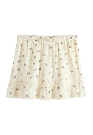 Falda de color crema con pequeños estampados florales rosas, cinturilla elástica con cordón y bajo con volantes y ribete de encaje.