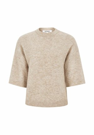 Beige kroports džemperis, izgatavots no mīksta adījuma. Tam ir īsas piedurknes, apaļš kakls un smalks raksts. Etiķete redzama kakla iekšpusē.