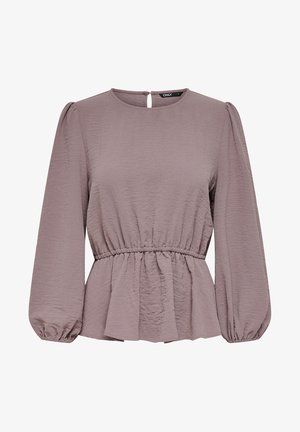 Peplum-paita pehmeässä mauve-värissä, jossa on pitkät puffi-hihat, gathers-elastinen vyötärö ja takana avainrei'itys. Teksturoitu kangas tuo ulottuvuutta.
