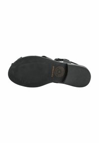 Zwarte sandalen zool met textuur, platte vorm en ronde logo-detail. Voorzien van banden voor een veilige pasvorm. Materiaal lijkt rubberachtig.