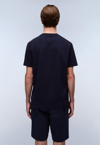 Navy cotton t-shirt with short sleeves, crew neck, and a straight cut. Features a smooth texture and minimalistic design.