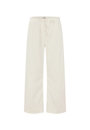 Krémové široké kalhoty z měkké tkaniny, s elastickým pasem na šňůrku a manžetami na koncích nohavic pro pohodlný střih.