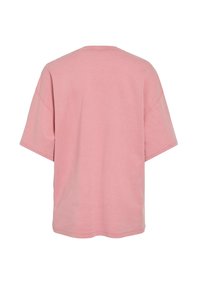 Roza oversized majica, izdelana iz mehkega bombaža, z udobnim krojem, kratkimi rokavi in okroglim izrezom. Brez vidnih vzorcev ali dodatkov.