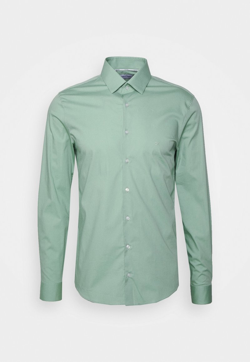 Chemise pour homme à manches longues, vert clair, avec boutons, col pointu et petit logo brodé sur la poitrine gauche.