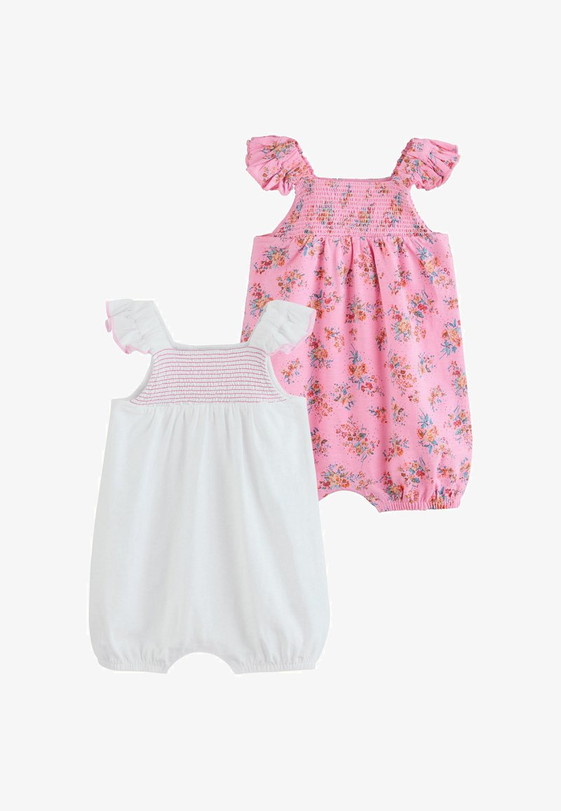 Två babysoveraller med veckade axelband, en enfärgat vit och en rosa med ett flerfärgat blommönster.
