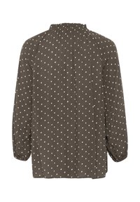 Blouse marron à pois blancs, avec un col montant, des manches longues et des fronces aux épaules et aux poignets.