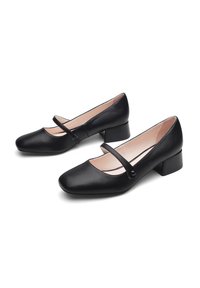 Chaussures Mary Jane en cuir noir avec un bout carré, un petit talon carré, et une sangle étroite avec un détail de bouton sur le cou-de-pied.