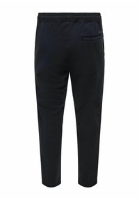 Zwarte taperende broeken met een elastische tailleband, met een achterzak en een gladde textuur, ontworpen voor comfort en bewegingsgemak.