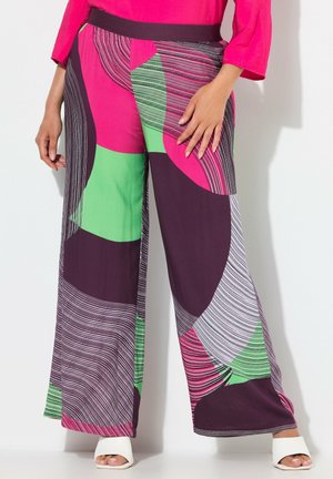 Pantalons larges arborant un motif géométrique multicolore dans les tons violet, rose, vert et blanc, avec une texture lisse et une taille élastique.