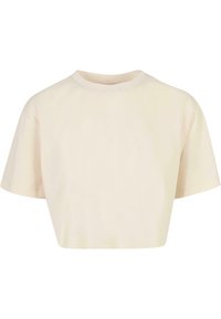T-shirt cropped a maniche corte beige con scollo rotondo, design semplice e vestibilità rilassata.