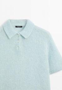 Light blue short-sleeve knitted polo sweater with a collar and three buttons, made by Massimo Dutti.