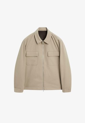Giacca beige con zip, colletto, maniche lunghe e due tasche frontali. Tessuto liscio e design snello.