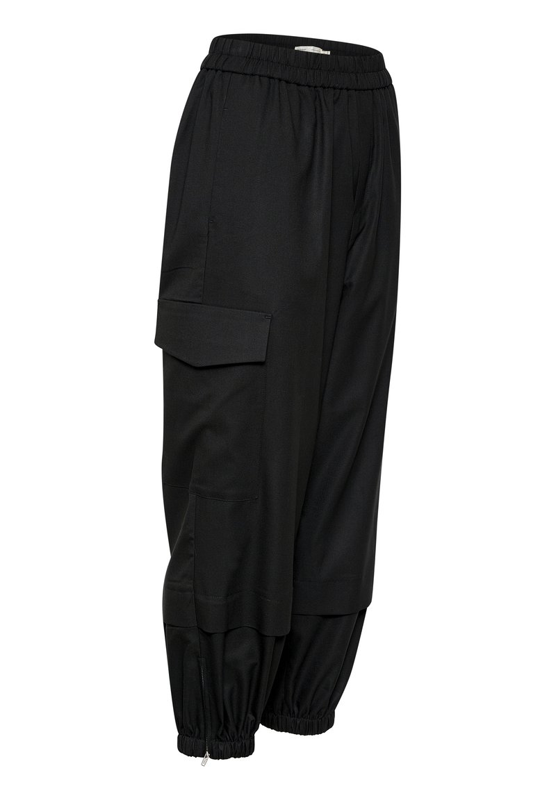 Schwarze Cargo-Hosen aus gewebtem Stoff, mit einem elastischen Bund, Seitentaschen und elastischen Bündchen mit Reißverschlüssen an den Knöcheln.