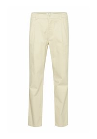Lichtbeige katoenen broek met een rechte pasvorm, voorzien van een knoop- en elastische tailleband, en twee voorzakken. Smooth textuur.