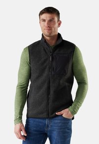 Men's zip-up vest made of soft gray fleece with a black nylon pocket. Features a high collar and side pockets, paired with a green long-sleeve shirt.
