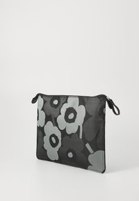 Floral laptop sleeve in black and grey fabric, featuring large flower designs, a zipper closure, and a loop for easy carrying.