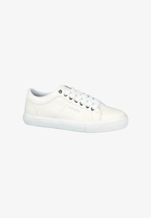 Zapatillas de lona blanca con suelas de goma, con punta redonda, cordones y detalle del logotipo en el lateral. Textura suave y diseño minimalista.