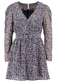 Vestido floral con fondo navy y pequeñas flores rosas y blancas, mangas largas translúcidas, escote en V y cintura ajustada. Tejido ligero.