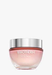Biotherm Aquasource Cica Nutri Cream i en klar, rund glasburk med ett silverlock. Krämen har en mjuk rosa färg.