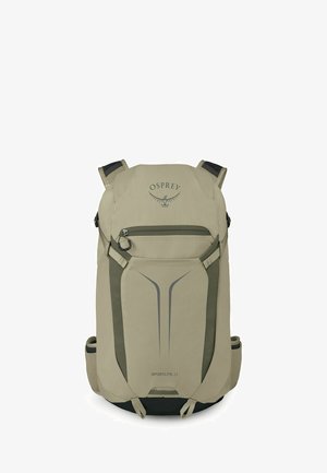 Sac à dos beige Osprey Sportlite 22 avec poche avant zippée, poignées supérieures, sangles latérales et panneau inférieur noir.