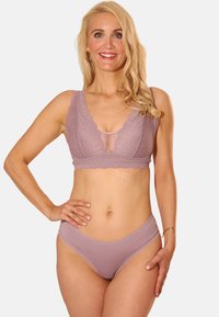 Lace bralette and matching panties in soft mauve. Features scalloped edges and sheer inserts. Smooth texture with delicate detailing.