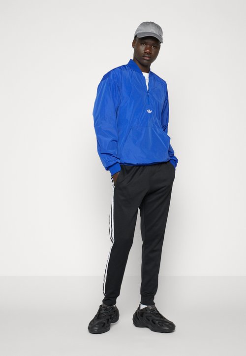 adidas Adicolor Classics SST Track Pants Black/White — foto 5