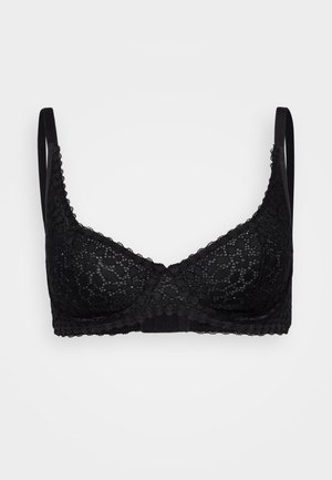 Black lace bra with underwire, floral pattern, adjustable straps, and a scalloped trim along the edges. Soft fabric with a smooth texture.