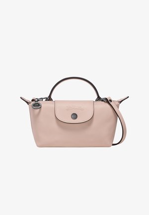 Pink leather handbag with a rounded top handle, detachable strap, and flap closure. Features embossed logo and metallic accents. Smooth texture.