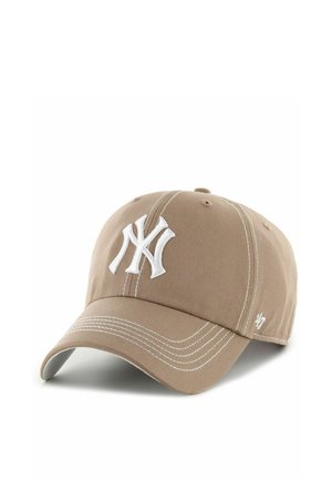Light brown baseball cap with white stitched New York Yankees logo on front and white stitching details on brim and panels.
