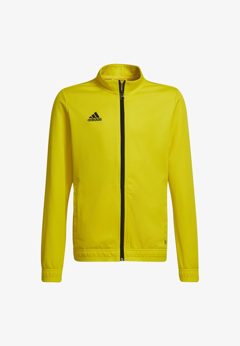 Gelbe Zip-Jacke aus glattem Stoff mit Stehkragen und schwarzem Adidas-Logo auf der oberen linken Seite. Verfügt über seitliche Taschen und einen schwarzen Reißverschluss.