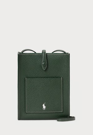 Dark green leather crossbody bag with a textured finish, featuring a front pocket and a small logo at the bottom. Adjustable strap included.