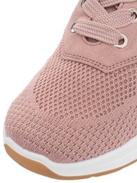 Close-up of the front part of a pink knit sneaker with thick laces, metal eyelets, white midsole, and tan rubber outsole.