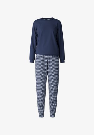 Navy long-sleeve top with a round neck, paired with patterned pants featuring a geometric design in white and green on a blue background.