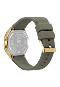 Orologio ottagonale con cassa in metallo dorato e cinturino flessibile in silicone verde oliva. Caratterizzato da un retro in acciaio inossidabile e una chiusura in metallo sicura.