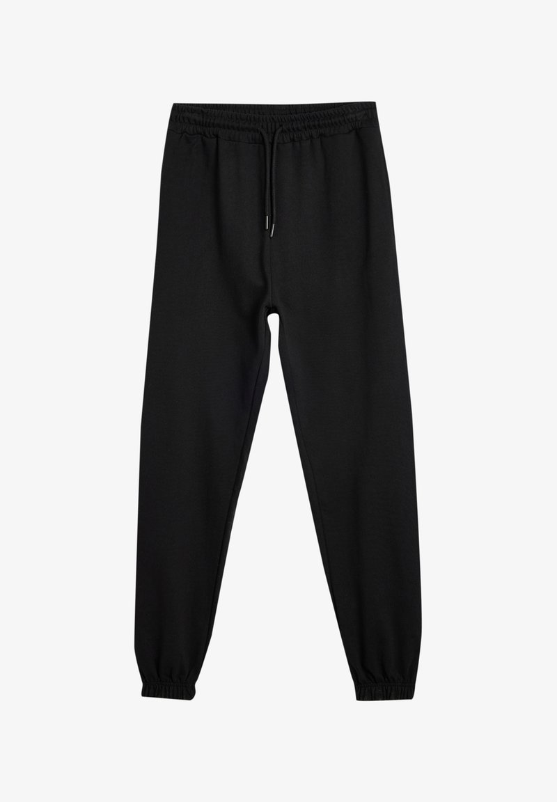 Zwarte sweatpants van zacht materiaal, met een elastische tailleband met trekkoord, taps toelopende boorden en zonder zichtbare patronen of accenten.