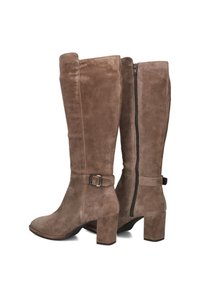 Brown suede knee-high boots with a square toe, a side zipper, and a decorative strap with a silver buckle around the ankle.