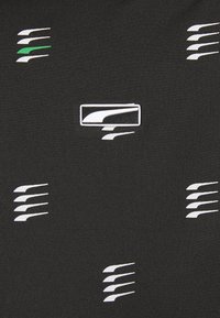 Black fabric with white and green graphic patterns of stylized lines, featuring a central rectangular logo. Smooth texture.