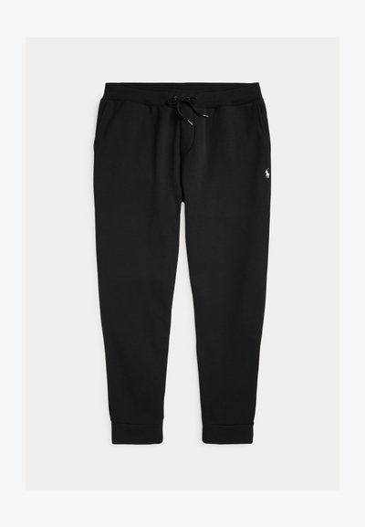 Mustad mustadest puuvillasegust kangast dressipüksid, millel on nööriga vöökoht, soonikkoes mansetid ja väike tikitud logo puusa peal.