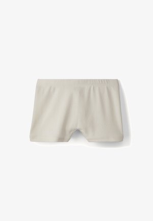 Shorts en coton beige avec une texture douce, dotés d'une taille élastique et d'un design simple et moderne. Aucun motif ni accent visible.
