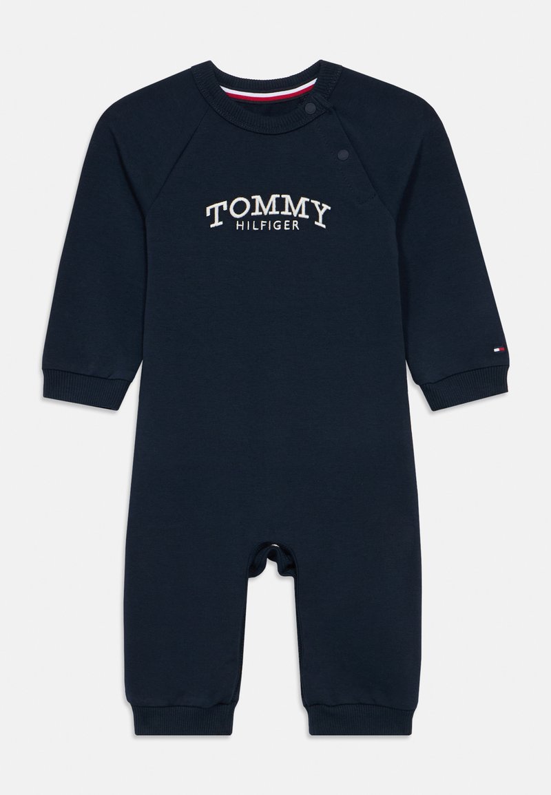 Mornarsko modra bombažna otroška bodi z dolgimi rokavi, rebrastimi zapestji, zapenjanjem na gumbke in z belo vezeno oznako "TOMMY HILFIGER".